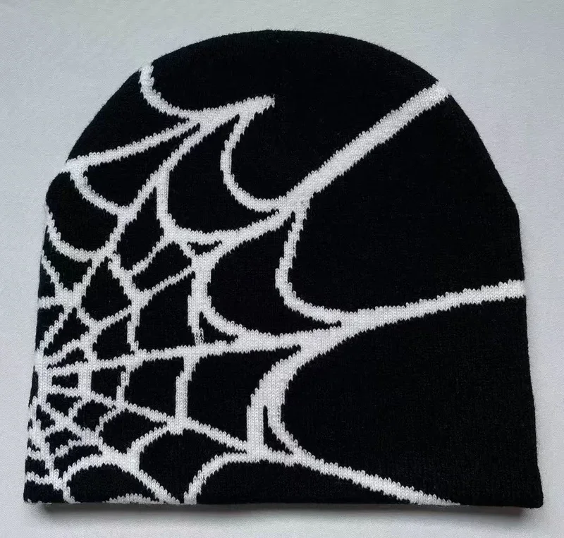 Black knit beanie with a white spiderweb motif