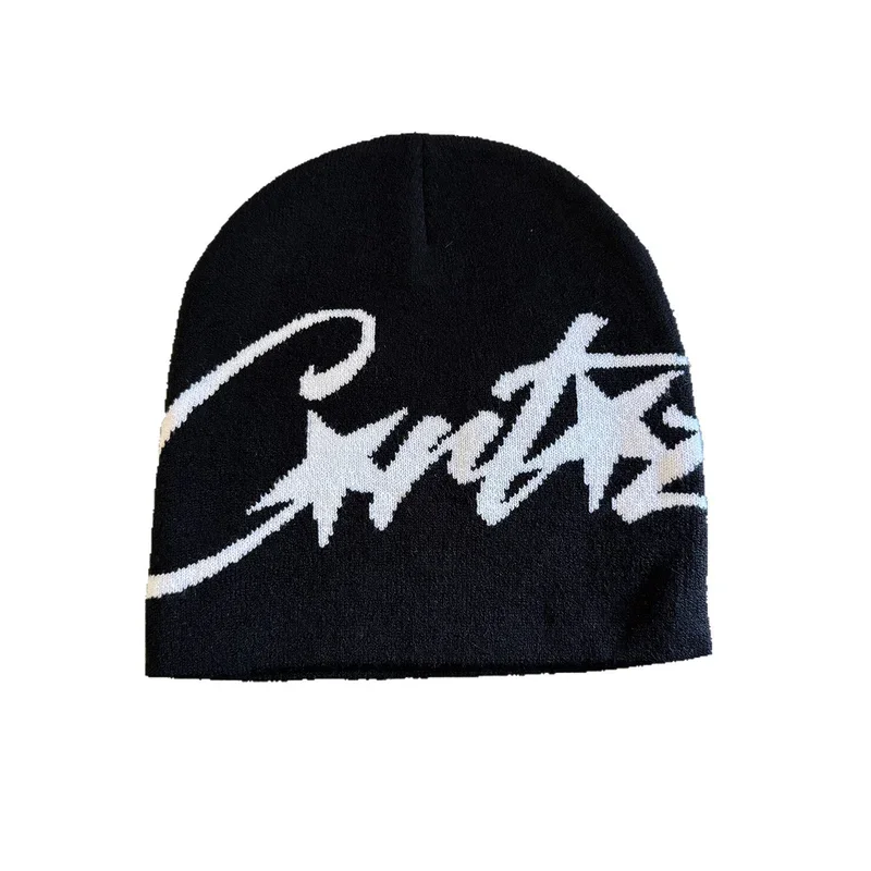 Black knit beanie with cream script lettering on white