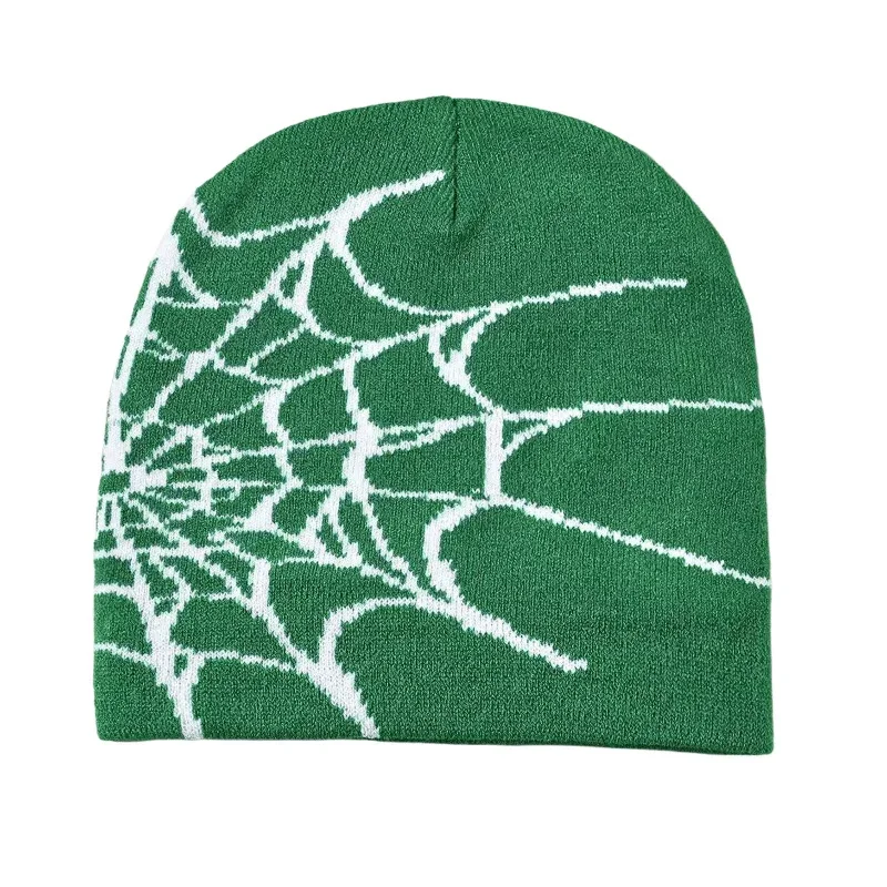 Green knitted beanie with a contrasting white spiderweb graphic.