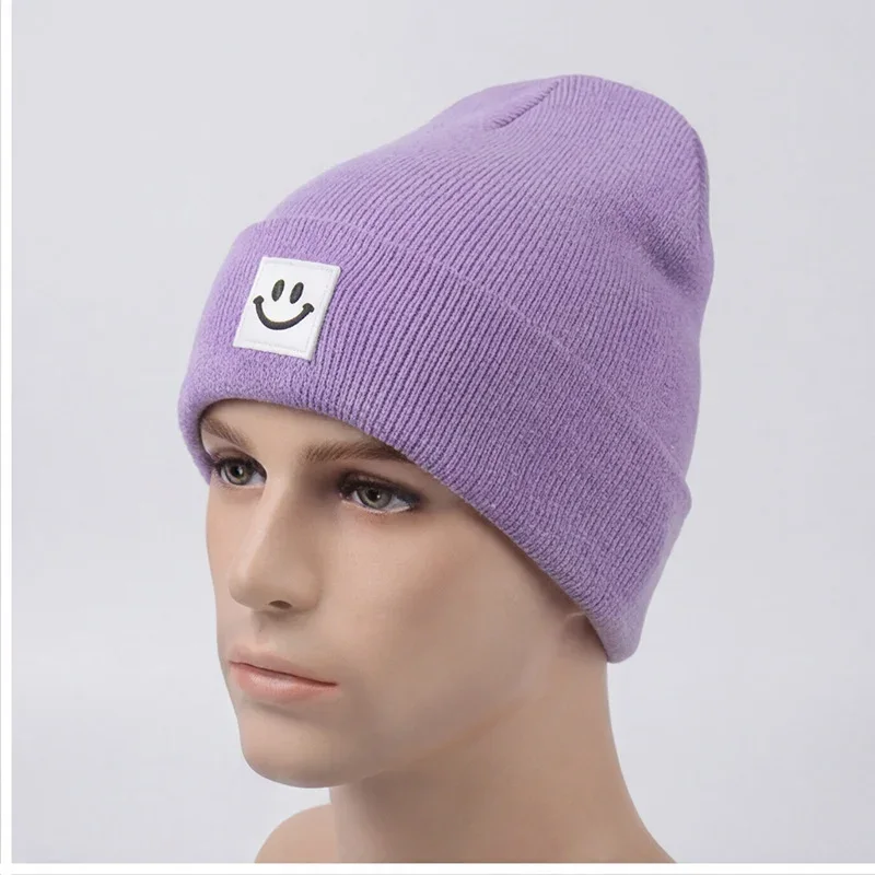 Lilac cuffed knit beanie with a smile label on a mannequin