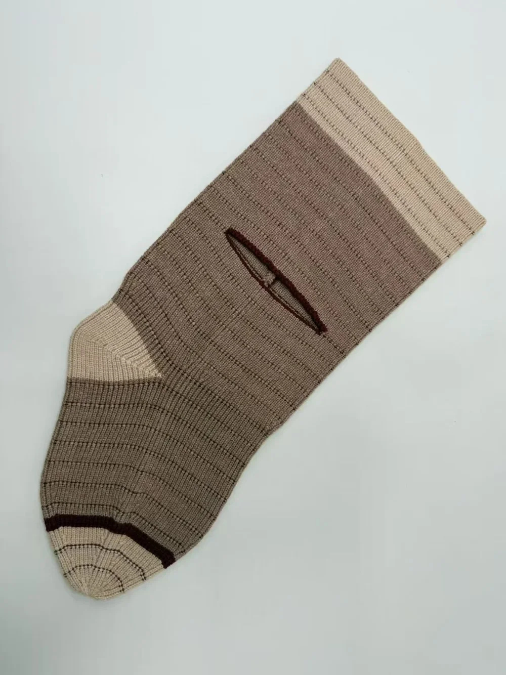 Taupe rib-knit sample laid flat with a slit opening